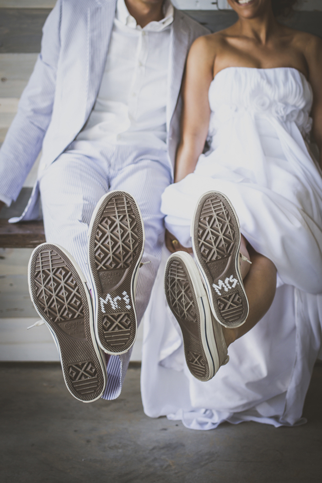 The bride and groom painted the bottom of their wedding Converse to read Mr and Mrs, so cute!