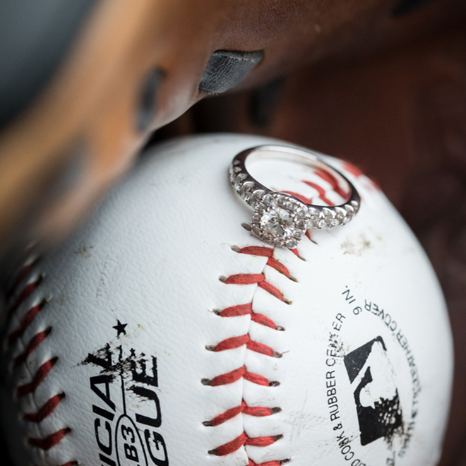 Beautiful wedding ring shot on top of a baseball - perfect idea for baseball fans!