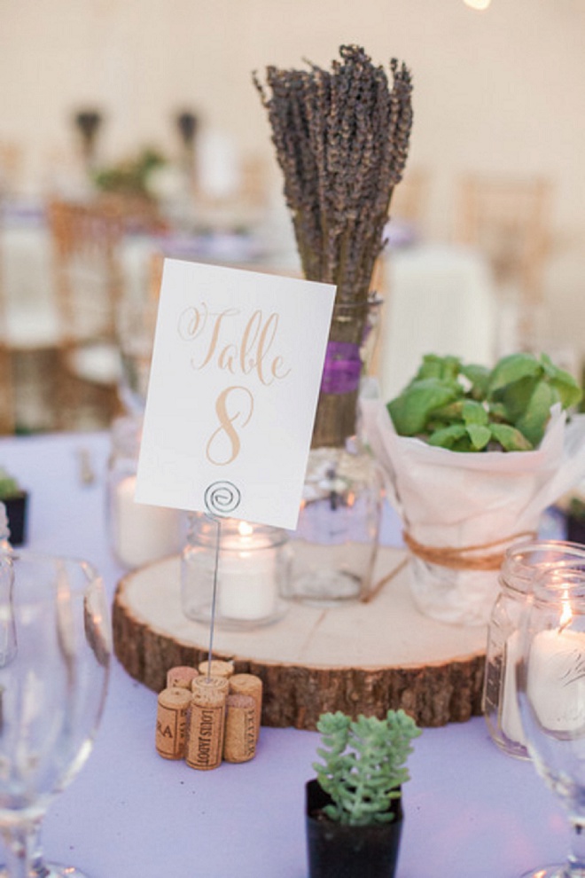 Gorgeous gold table numbers and wooden centerpieces at this DIY desert wedding!