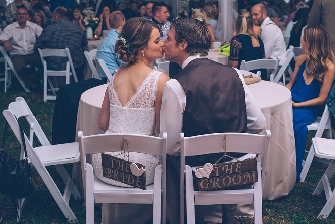 We're loving this gorgeous wedding and these fun wooden Bride and Groom chair signs!