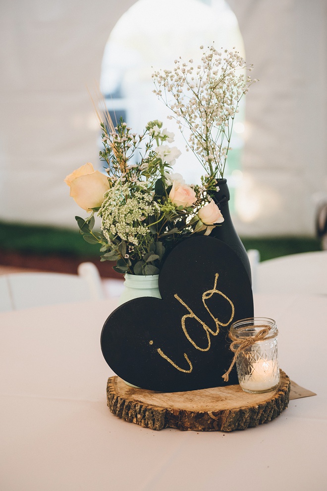 Loving the wood and chalkboard centerpieces at this gorgeous barn wedding!