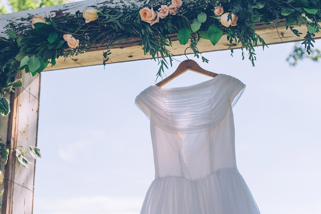 We're swooning over this Bride's vintage wedding dress at this gorgeous outdoor DIY wedding!