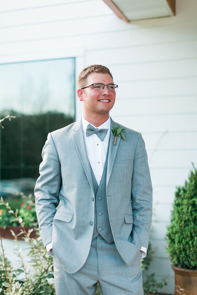 Handsome Groom with his boho chic green boutonniere!