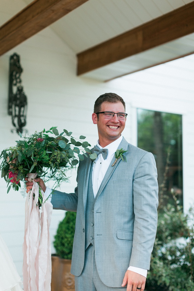 How darling is this shot of the Groom with his Bride's bouquet?! Love!