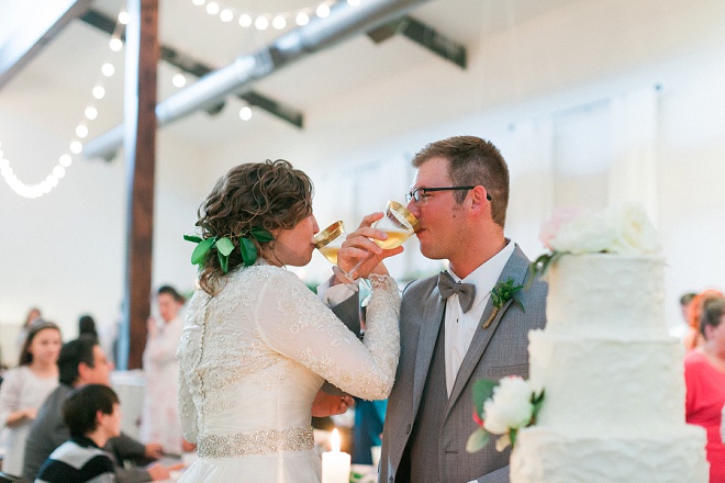 We're LOVING this shot of the Bride and Groom and their gorgeous gold toasting glasses!