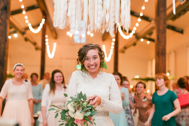 We love this shot of the Bride before she throws her gorgeous bouquet!