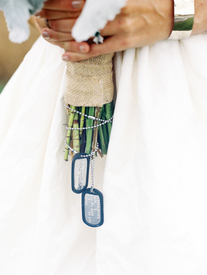 The bride carried her dad's dog tags tied around her bouquet!