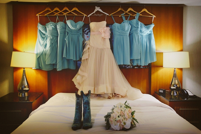 We're loving this Bride's fun blush dress and cowgirl boots for her barn wedding!