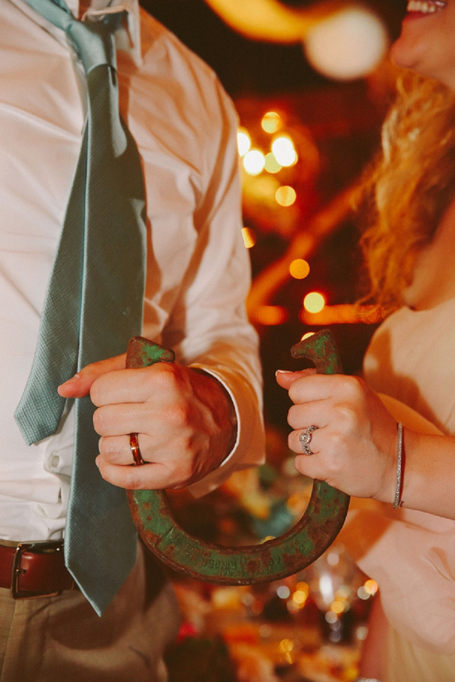 Swooning over this gorgeous Bride and Groom ring and horseshoe shot of the Mr. and Mrs!