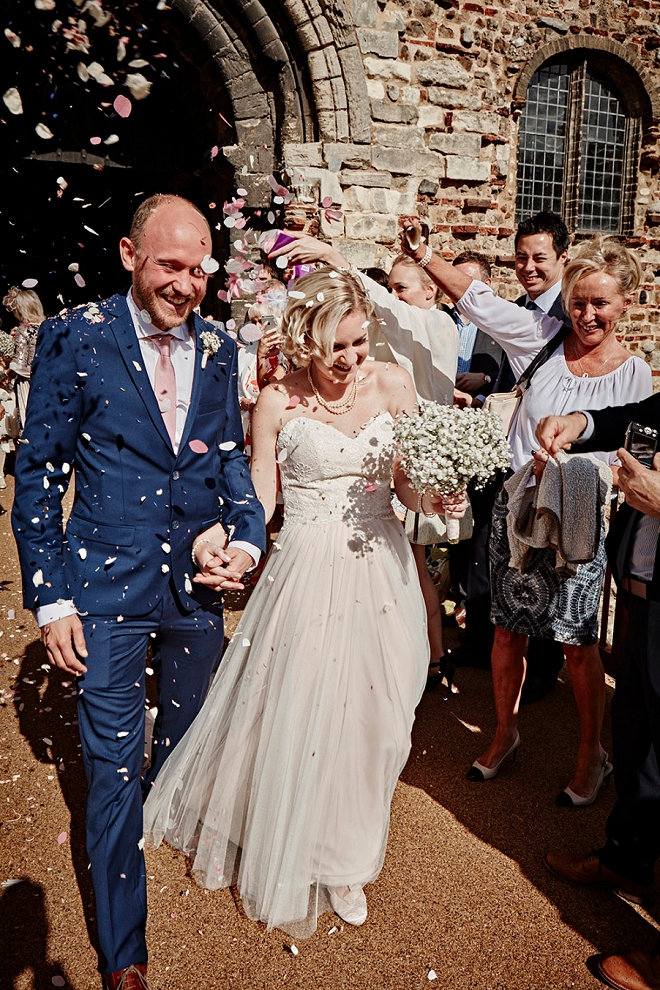 Loving this fun photo of the Bride and Groom after their ceremony with a confetti exit!