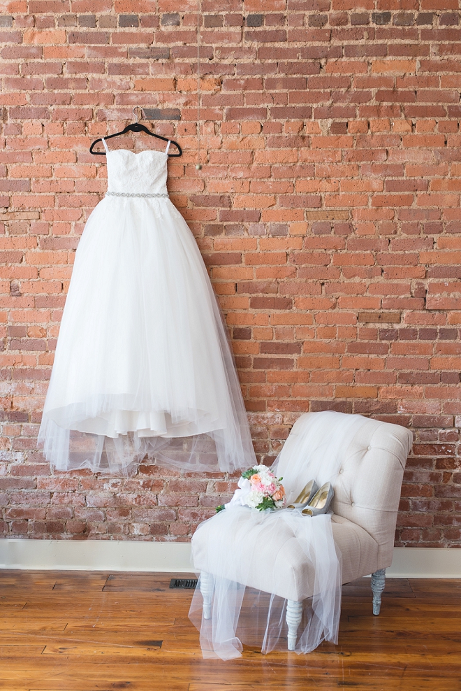 How gorgeous is this Bride's classic wedding gown?! We're in love with the story of this dress!