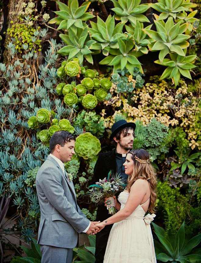 Gorgeous succulent backdrop for this outdoor ceremony!