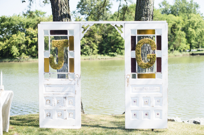 How darling are these barn doors and monograms on this rustic outdoor wedding ceremony! 