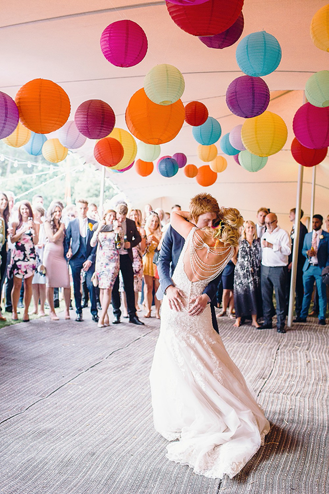 Colorful paper lanterns pop against a white tent