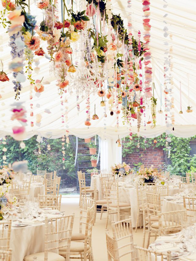whimsical floral garlands strung from a tent is the perfect way to brighten up the space