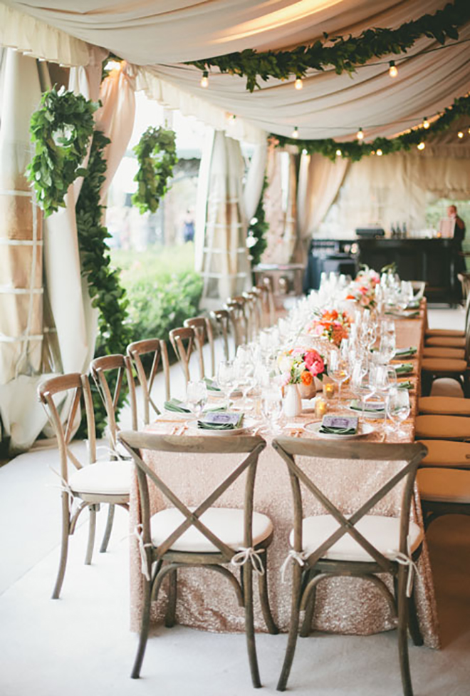 greenery garlands add a chic and natural element to a wedding tent