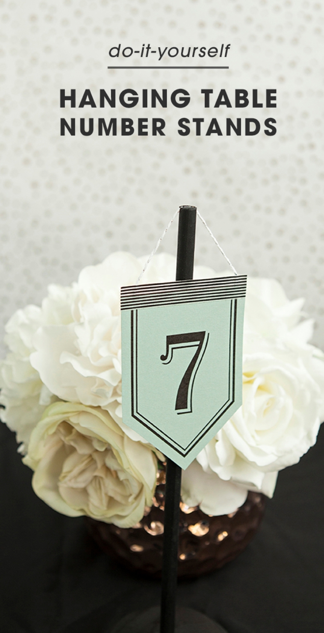 Check out these unique, DIY hanging table number stands with free printable numbers!