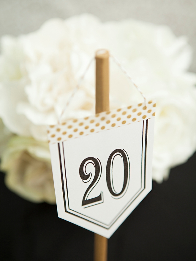 Check out these unique, DIY hanging table number stands with free printable numbers!