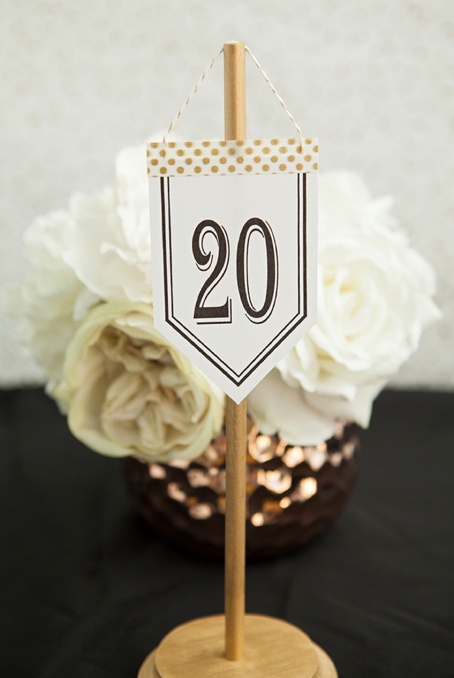 Check out these unique, DIY hanging table number stands with free printable numbers!