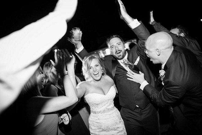 Such a fun snap of the new Mr. and Mrs. leaving their reception!