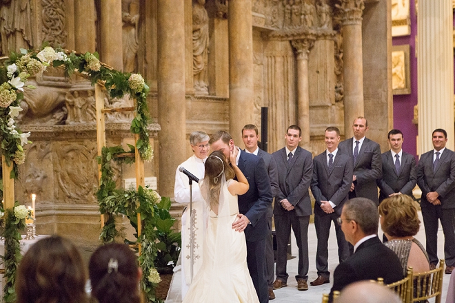 First kiss as Mr. and Mrs! We're loving this gorgeous museum wedding!
