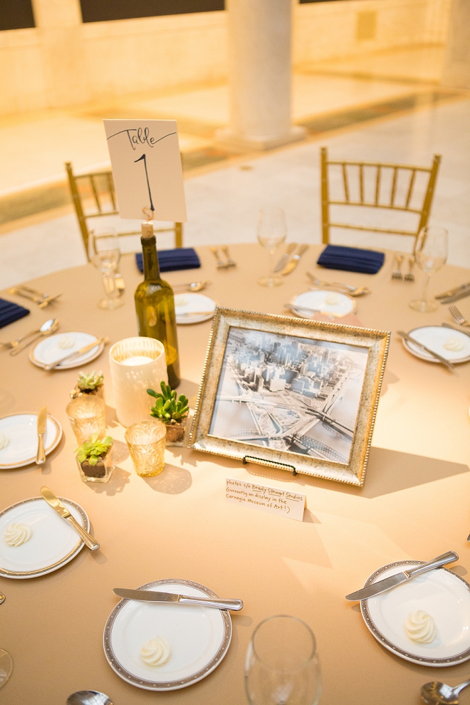 We're loving the wine bottle table numbers and navy details at this gorgeous art museum wedding!