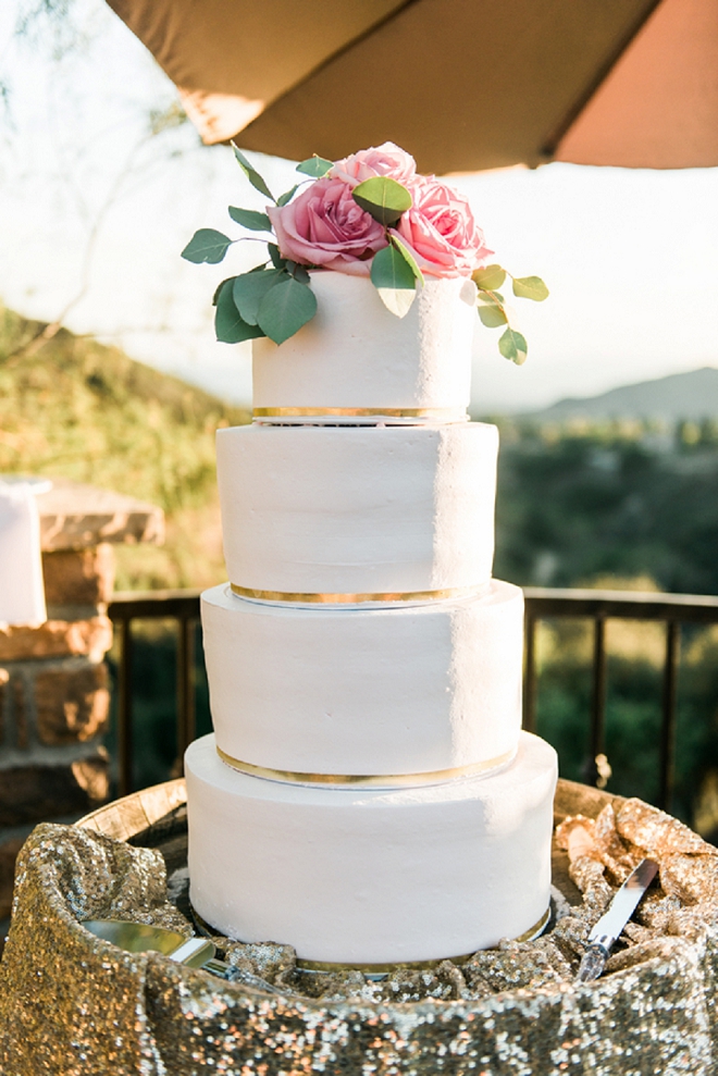 Loving this amazingly gorgeous classic wedding cake with pink cake topper!