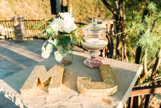 Loving the gold glitter monogram details at this gorgeous California wedding!