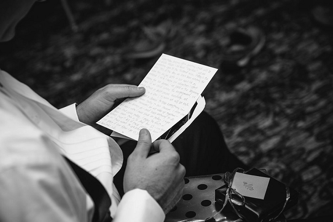 Love this shot of the Groom reading a note from his Bride the morning of their wedding!