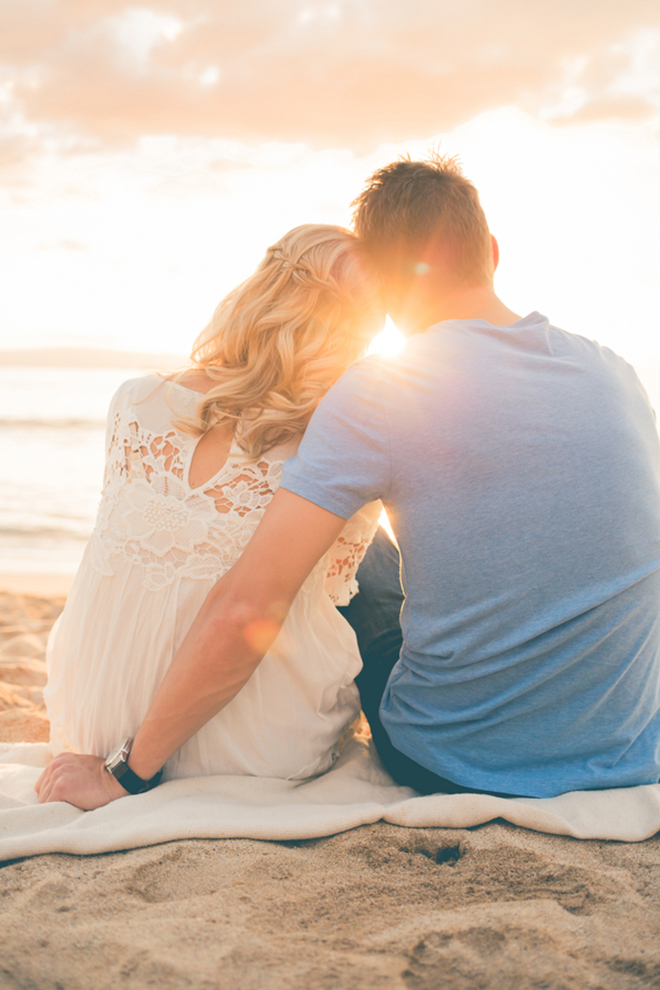 Gorgeous snap of a couple on the sand at sunset during their engagement!