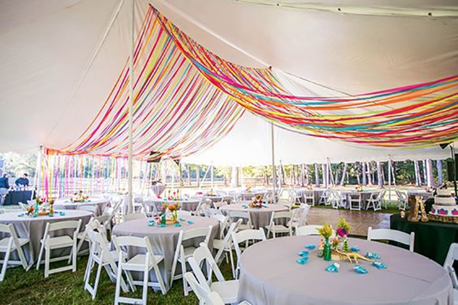 ribbon is a whimsical way to add color to a wedding tent