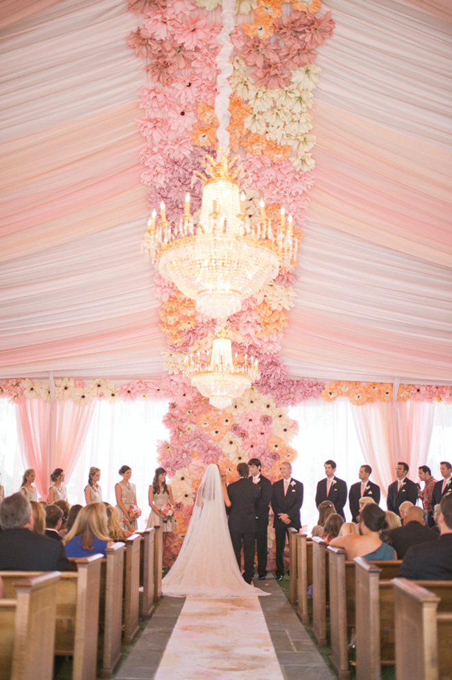 We're SWOONING over this amazing floor to ceiling floral ceremony backdrop!