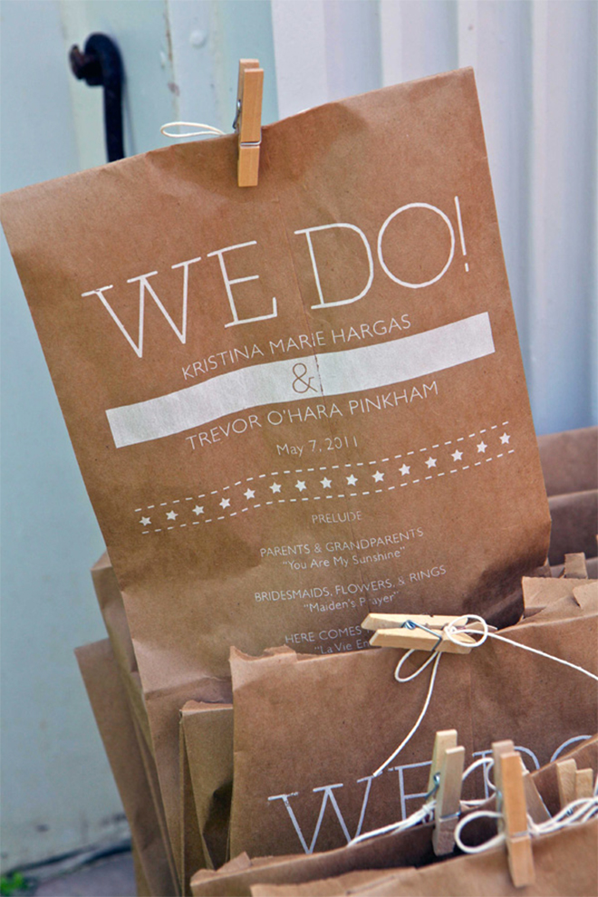 these adorable wedding program pouches have pom poms inside!