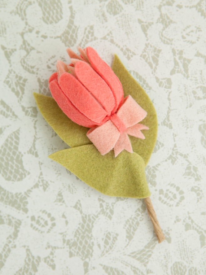 The most darling felt protea boutonniere!
