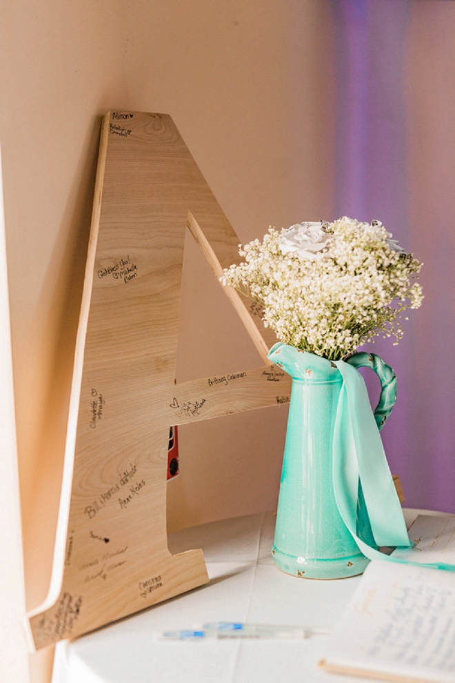 Loving this cute monogram guest book at this gorgeous wedding!