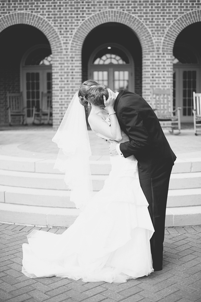 Beautiful shot of a groom kissing his bride!