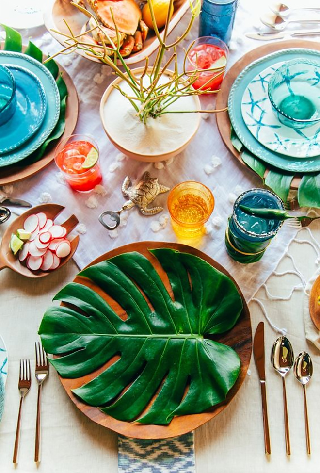 layer the table with leaves and textiles to save on flowers.