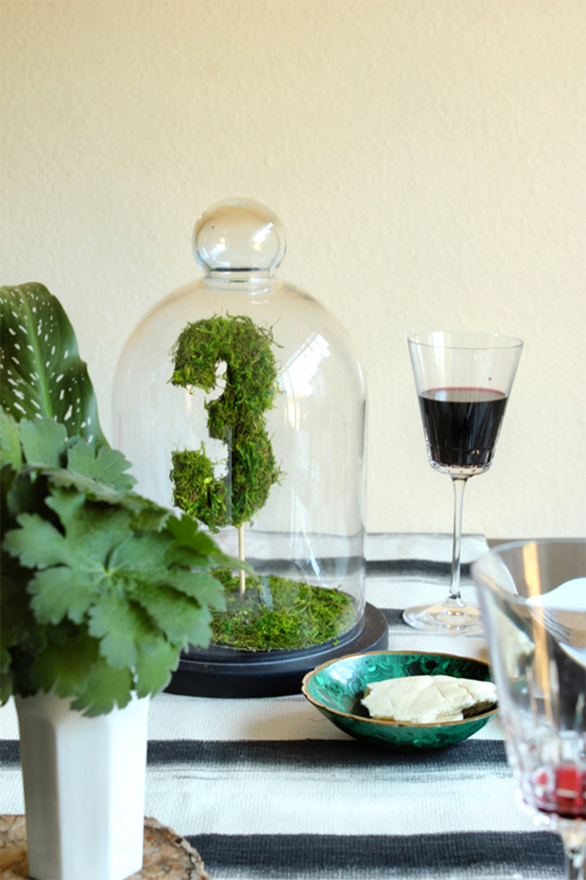 DIY moss table numbers double as a beautiful centerpiece.