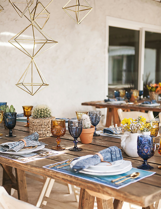 hanging geometric shapes draw the eyes up from the table. 