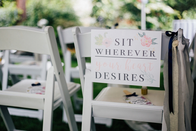 We love this couple's Sit Wherever ceremony sign!