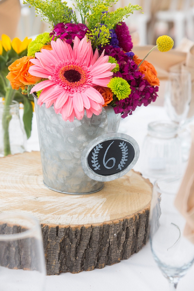 We love the rustic wooden centerpieces at this stunning fall wedding!