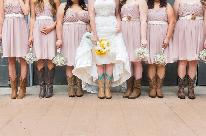 We LOVE this Bride and her Bridesmaid's cowgirl boots for the big day!