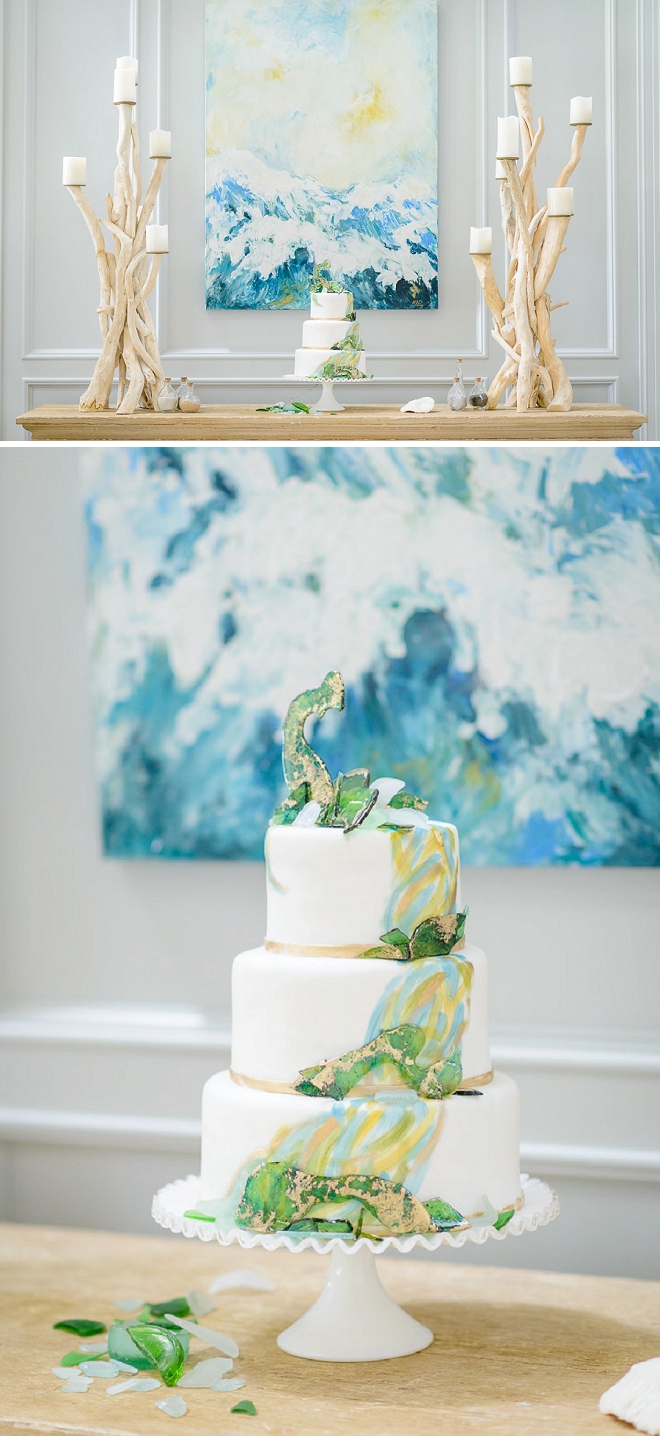 In LOVE with this stunning wedding cake with sea glass decor!