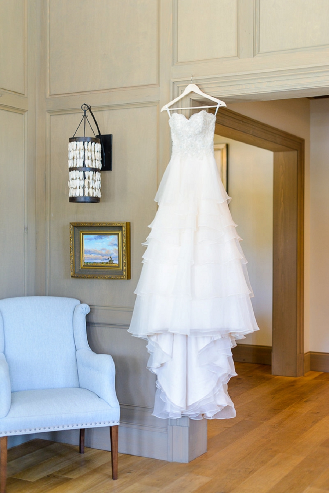 We're in LOVE with this dress shot at this stunning coastal wedding!