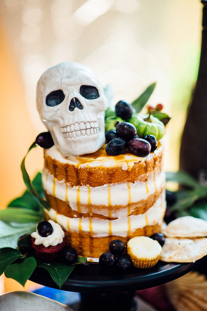 We can't get over this fun cake with skull cake topper at this styled Day of the Dead wedding shoot!