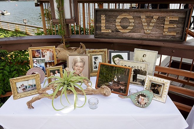 Loving the family photo table at this couple's wedding reception!