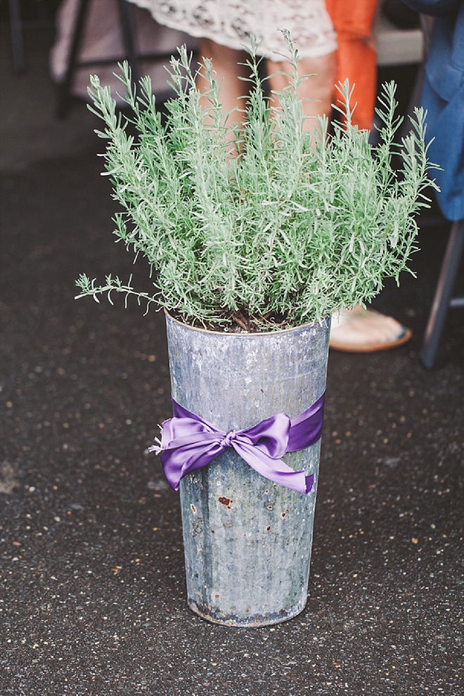 We love these lavender bouquets lining the ceremony!