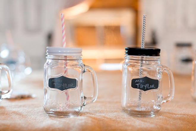 How sweet are these Mr. and Mrs. mason jar cups at this darling reception?! Love!