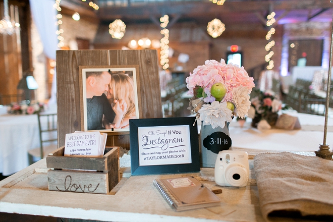 How darling is this couple's reception welcome table with whiskey barrels?!
