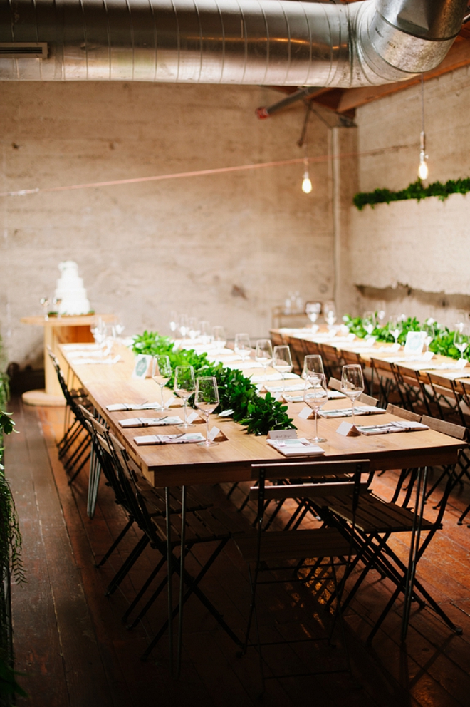 We're SWOONING over these farmhouse greenery covered reception tables!